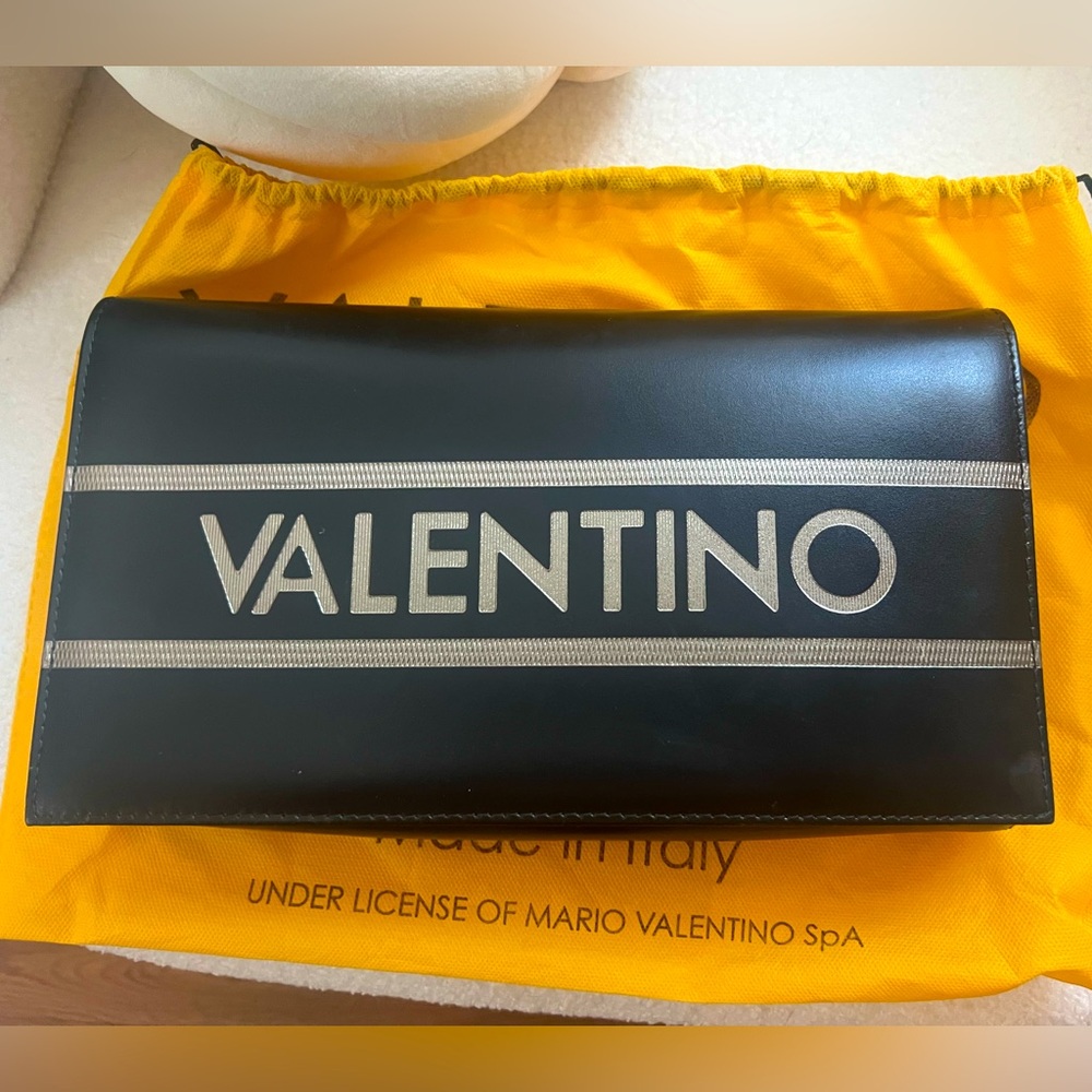 Valentino Clutch/Crossbody bag. Impeccable condition. From Saks include dust bag